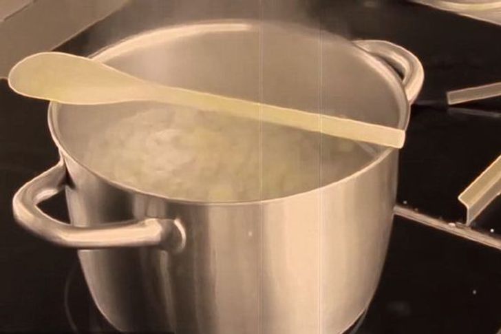 Add a wooden spoon over the top of a pot to prevent it from boiling over.